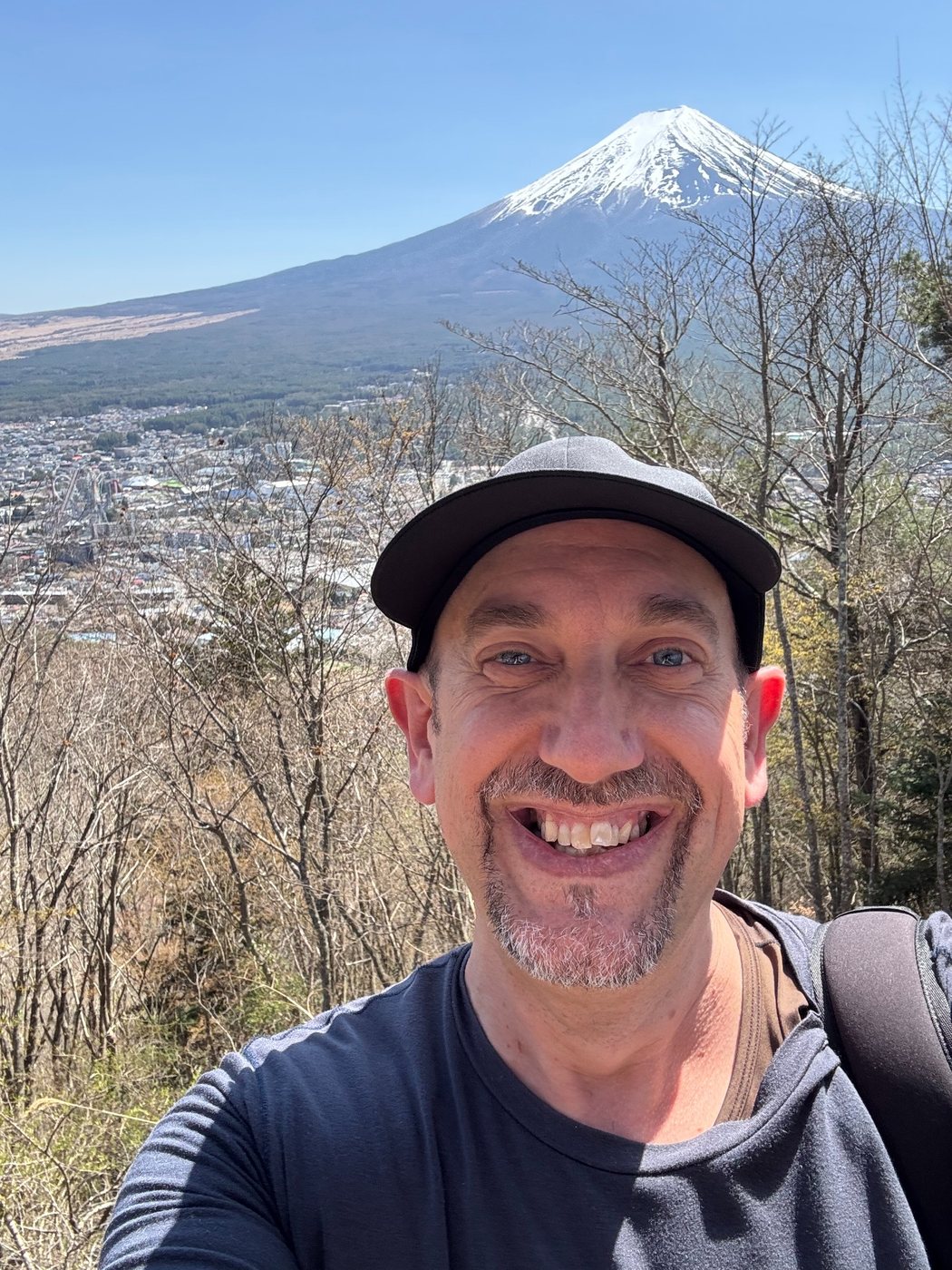 Nicolas smiling with Mount Fuji behind him